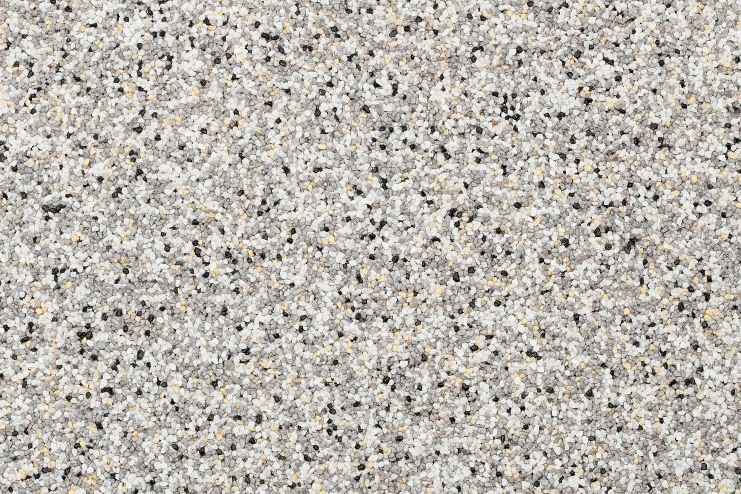 Oberfläche Buntsteinputz in Kornstärke K 1,5 StoSuperlit, grau-bunt, hell