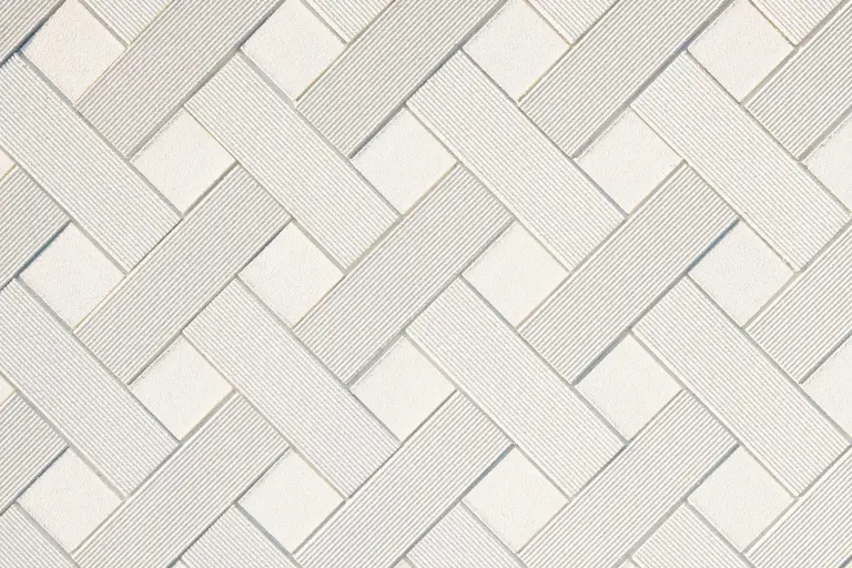 Eine Detailansicht eines vorgefertigten Putzelements im Rautenmuster, Putztextur 100