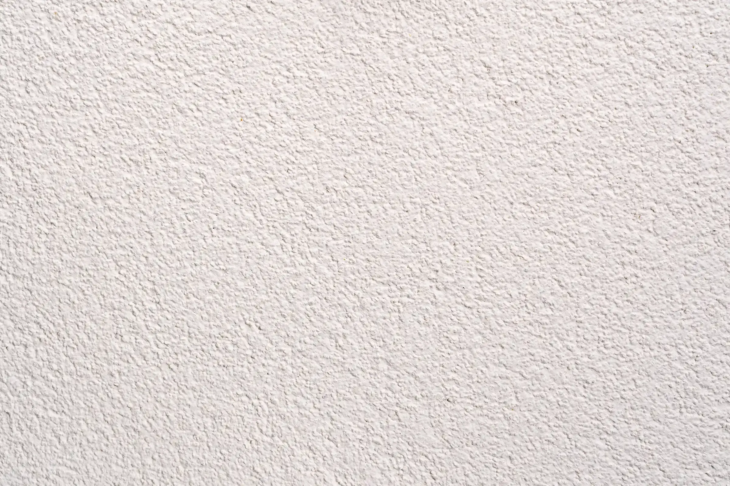 Detailansicht der weißen Putzflächen an einem Wohnquatier