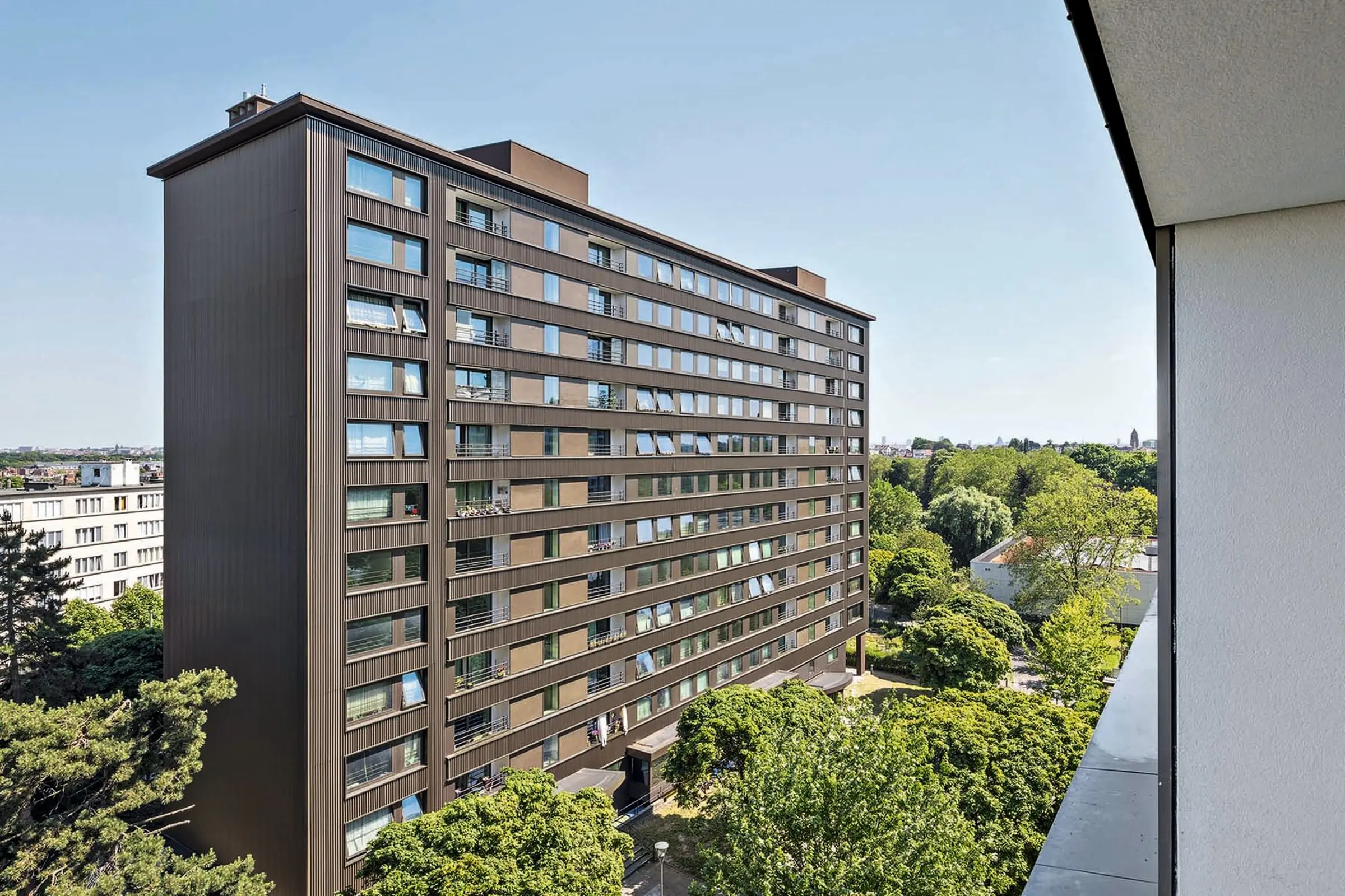 Aufnahme eine Mehrfamilienhauses gedämmt mit VHF von Sto, StoVentec Glass, Mosaik