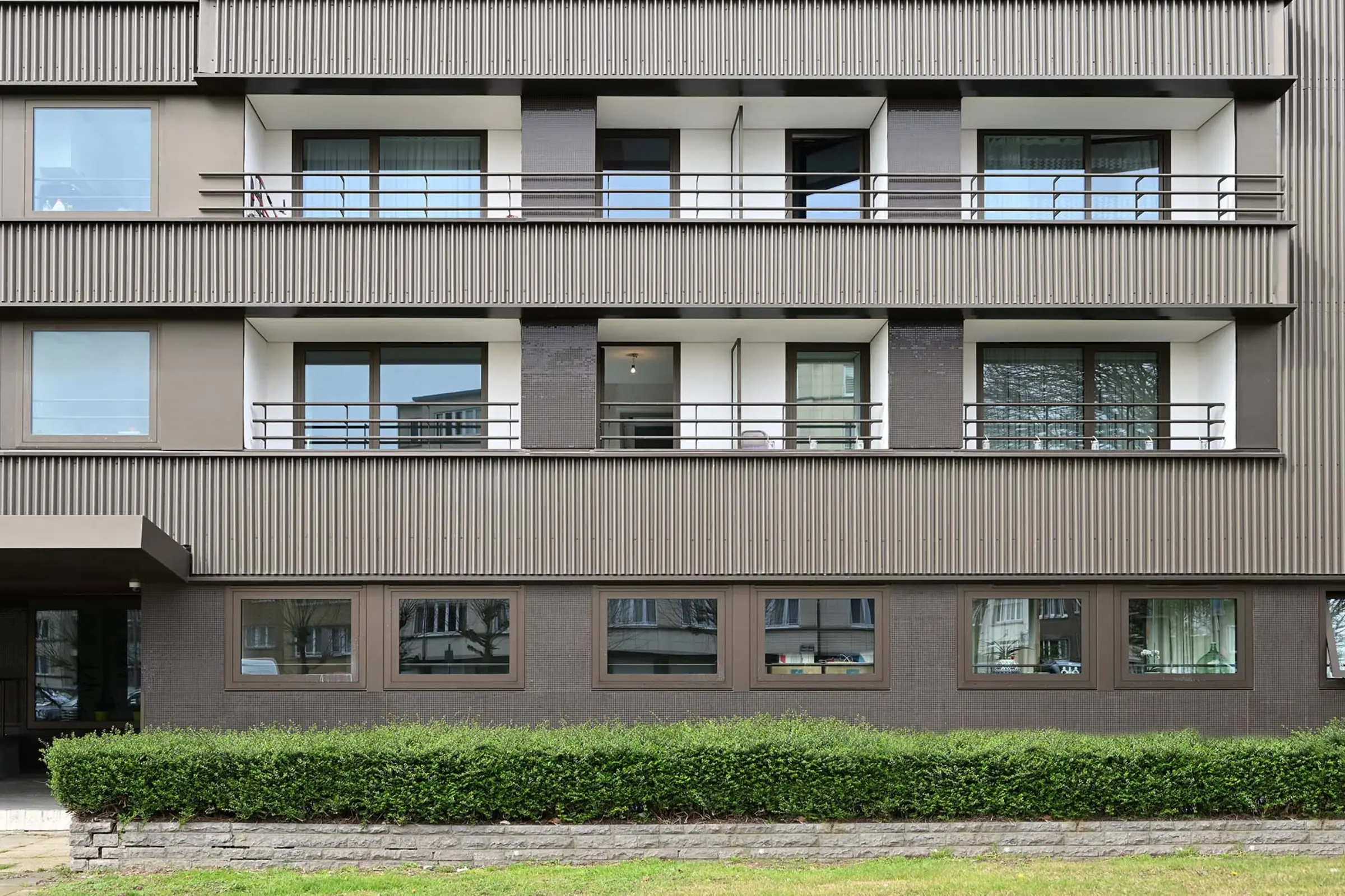 Aufnahme eine Mehrfamilienhauses gedämmt mit VHF von Sto, StoVentec Glass, Mosaik 